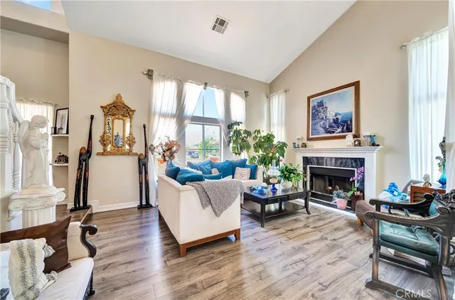a living room with furniture gym equipment and a flat screen tv