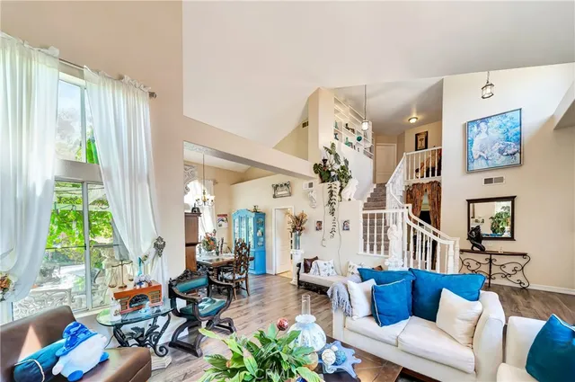 a living room with fireplace furniture and a flat screen tv