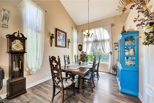 a living room with furniture a flat screen tv and a large window