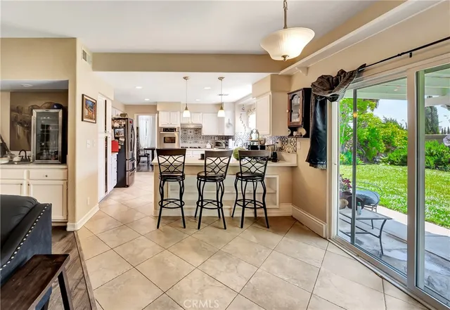 a view of a livingroom with furniture and a workspace