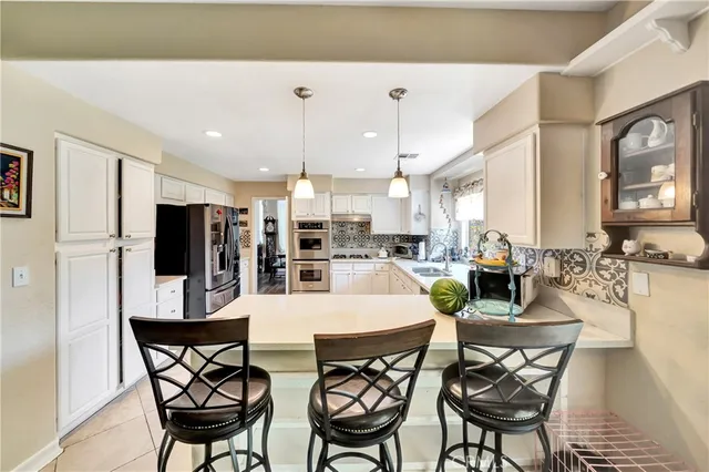 a spacious bedroom with a bed and a large window