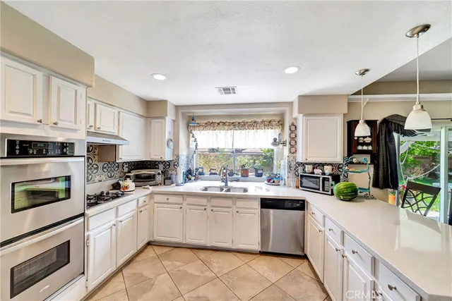 a bedroom with furniture and a flat screen tv