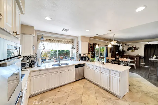 a spacious bathroom with a double vanity sink a mirror and a bathtub