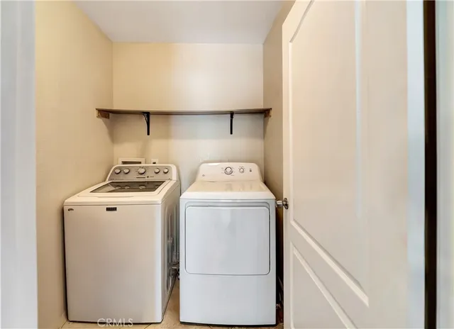 a en suite bathroom with a double vanity sink mirror and bathtub