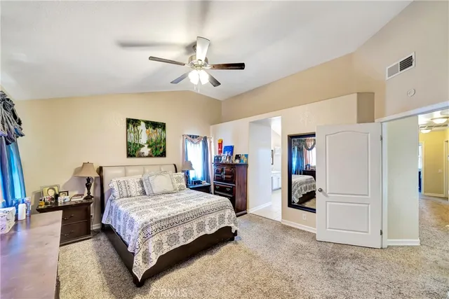a bedroom with furniture and a window