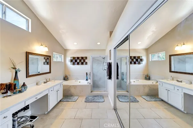 a bathroom with a double vanity sink and a mirror