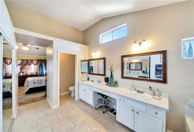 a view of a house with swimming pool and sitting area