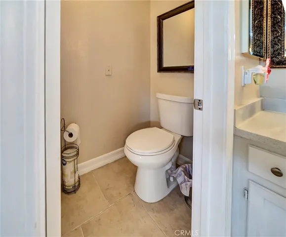 a view of a house with swimming pool and sitting area