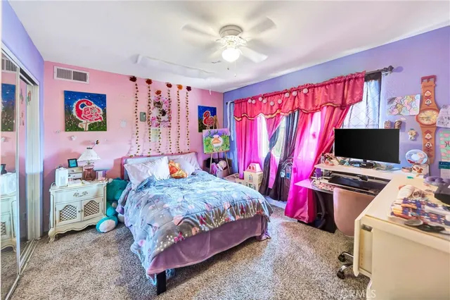 a view of a patio with table and chairs and potted plants