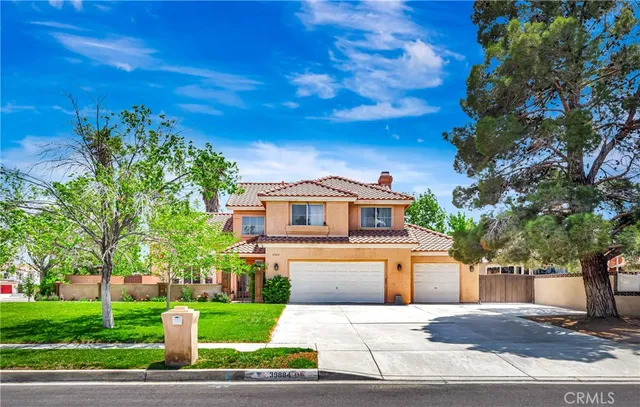 a living room with furniture a fireplace and a large window