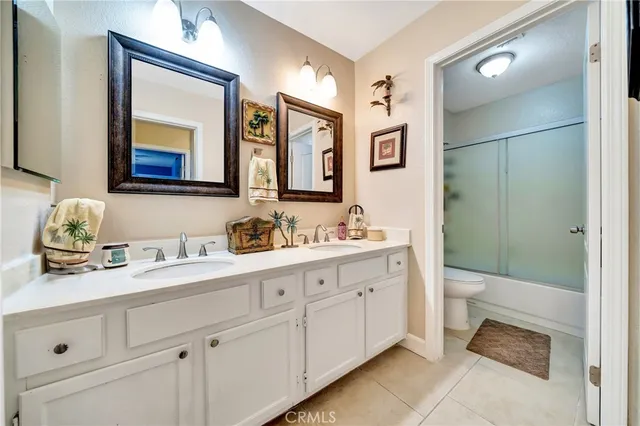 a view of a patio with couches table and chairs and potted plants