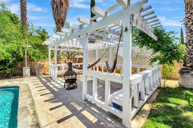 an aerial view of a house with a yard and large trees