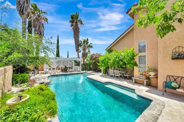 an aerial view of a house with a yard and a garden
