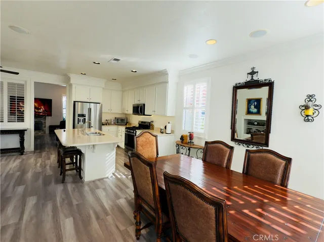 a kitchen with a table and chairs in it