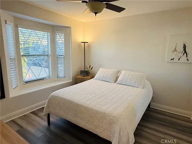 a bedroom with a bed and a desk