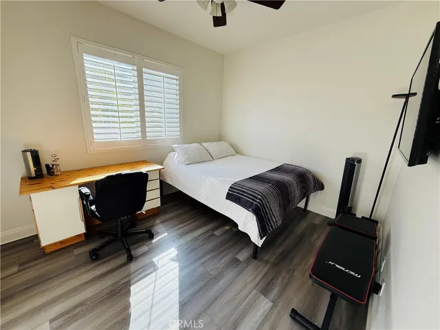 a bedroom with a bed and a chair