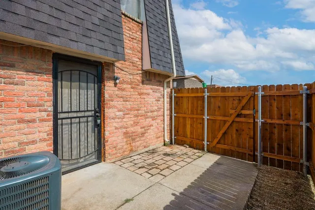 a view of a door and wooden floor