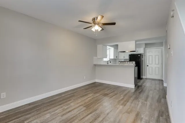 a view of a kitchen with a dishwasher and a refrigerator