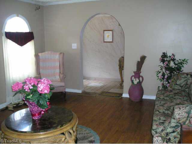 1513 East Fairfield Road High Point, NC 27263 - Photo 2 of 9 Other. Arched Doorway to Foyer, note tile flooring in Foyer, wood flooring in Living