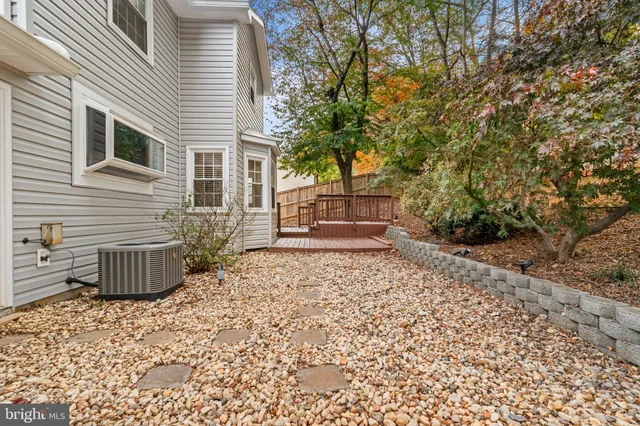 a backyard of a house with a tree