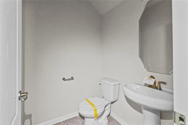 a bathroom with a toilet and a sink
