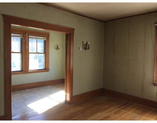 28 Rawson Avenue Lexington, MA 02420 - Photo 4 of 4 a view of an empty room with wooden floor and a window