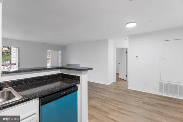 a view of a hallway with washer and dryer