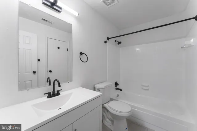 an aerial view of residential building and trees around