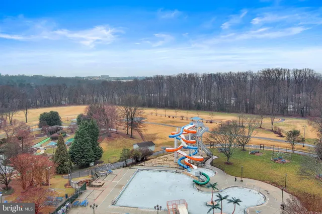 a front view of a building with a garden