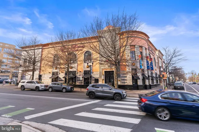 a view of a swimming pool with an outdoor space and seating area