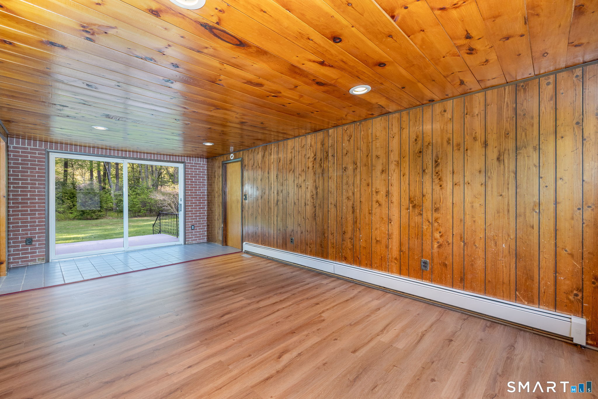 50 Brook Road Enfield, CT 06082 - Photo 14 of 34 a view of an empty room with wooden floor and a window