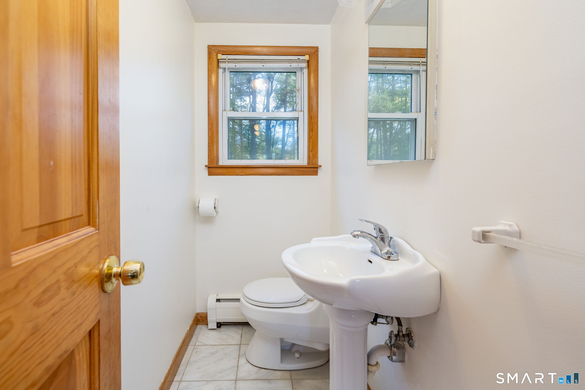 50 Brook Road Enfield, CT 06082 - Photo 15 of 34 a bathroom with a sink toilet and a mirror