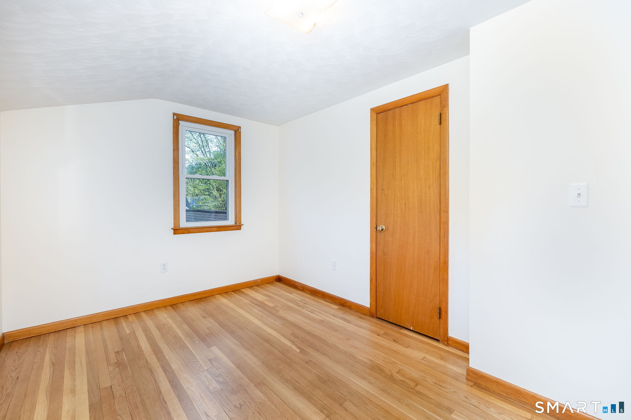 50 Brook Road Enfield, CT 06082 - Photo 23 of 34 a view of empty room with wooden floor and fan