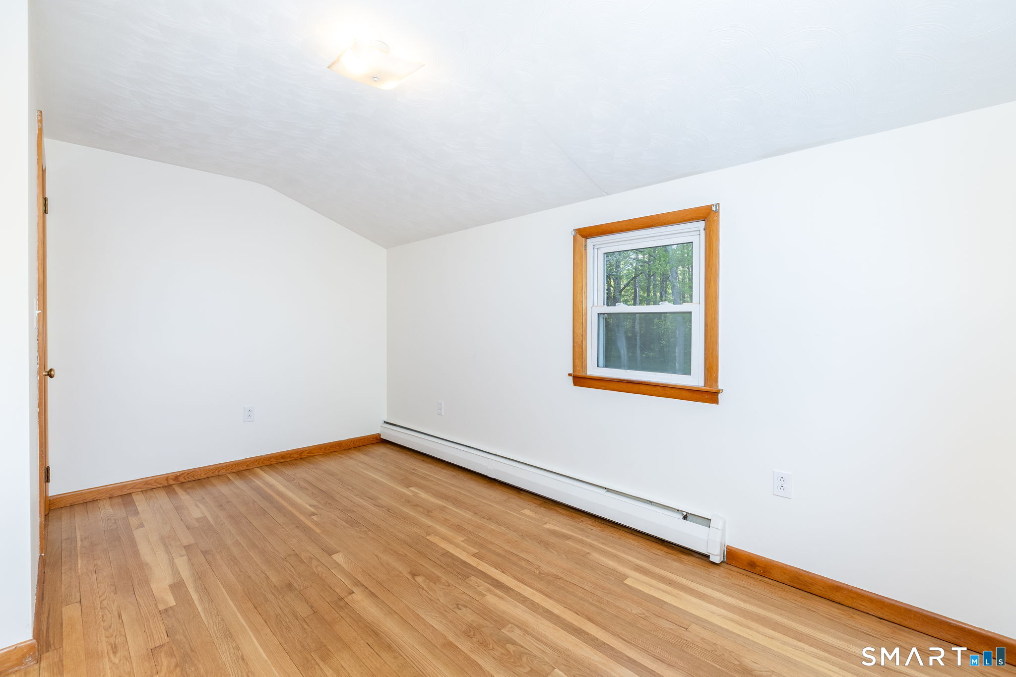 50 Brook Road Enfield, CT 06082 - Photo 24 of 34 a view of an empty room with wooden floor and a window