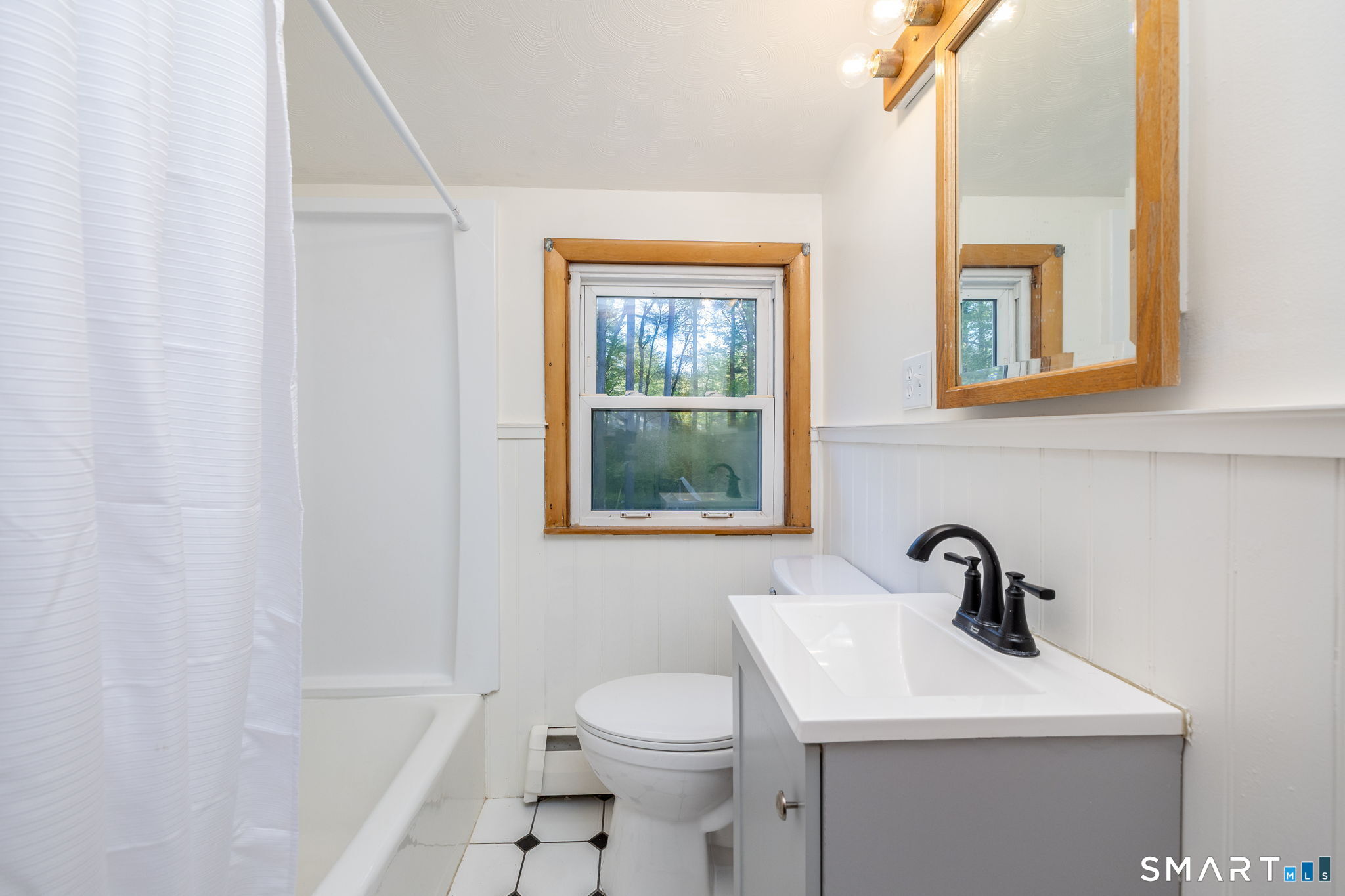 50 Brook Road Enfield, CT 06082 - Photo 25 of 34 a bathroom with a sink a toilet and a tub