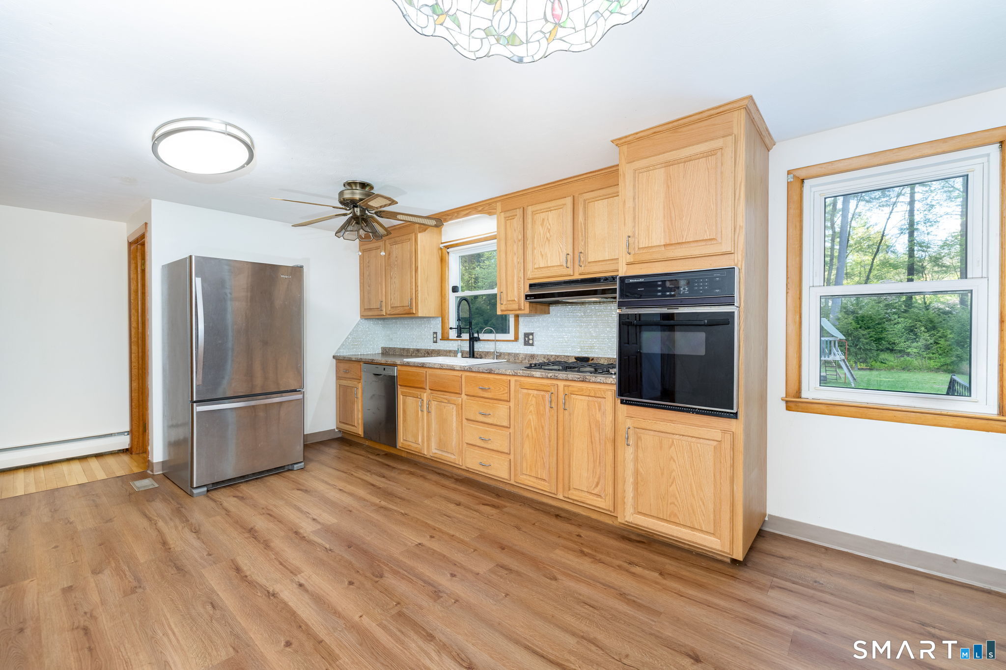 50 Brook Road Enfield, CT 06082 - Photo 6 of 34 a kitchen with stainless steel appliances a refrigerator and a stove top oven