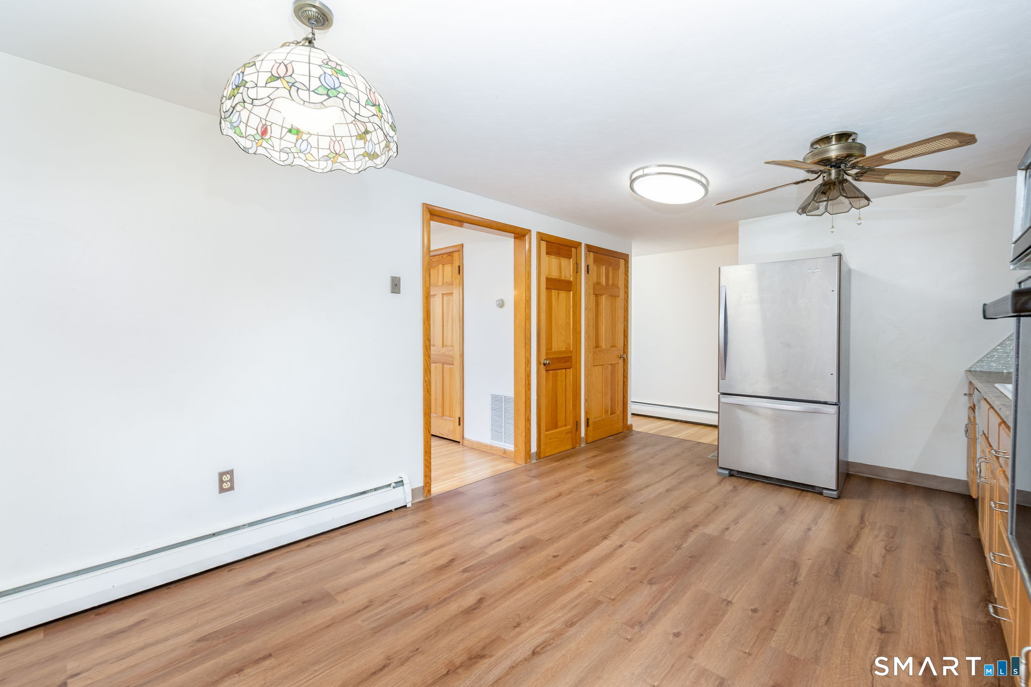 50 Brook Road Enfield, CT 06082 - Photo 8 of 34 a view of a room with wooden floor and chandelier