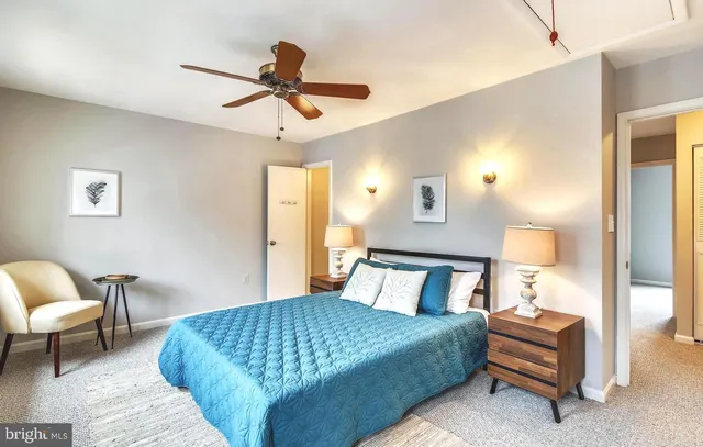 a bedroom with a bed and a chair