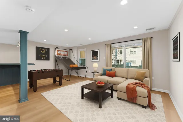 a living room with furniture and a table