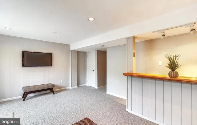 a view of a livingroom with furniture and a window