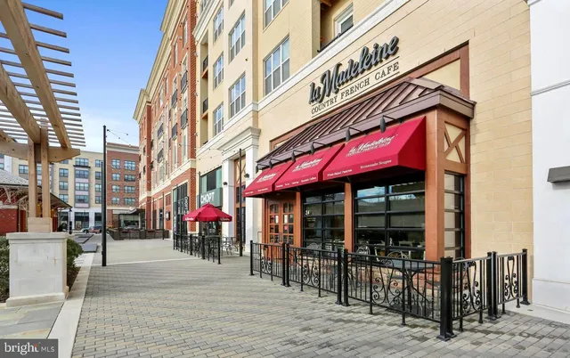 a view of a cafe with sitting area