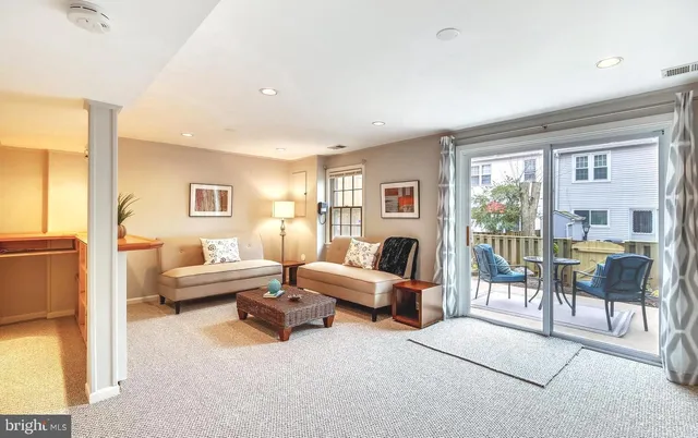 a living room with furniture and a table