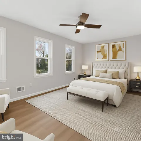 a bedroom with a large bed and a window