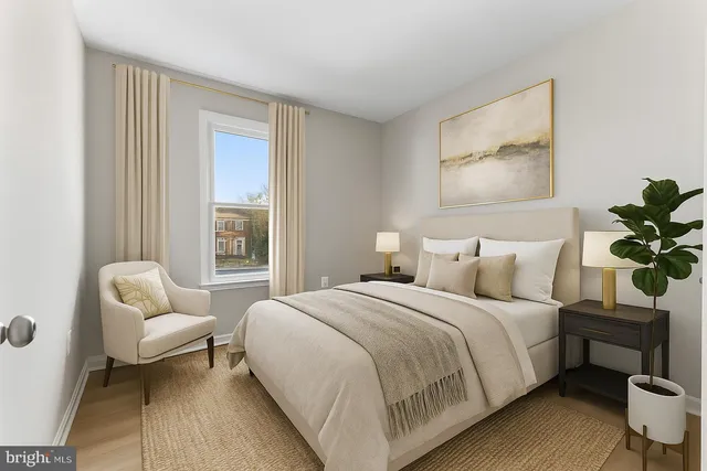 a bedroom with a bed and a couch