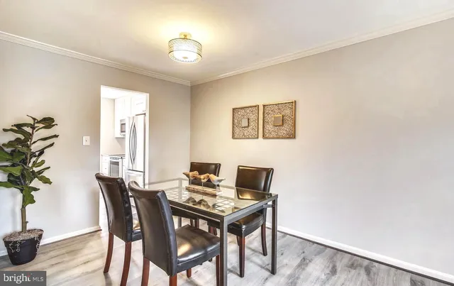 a view of a workspace with furniture and a potted plant