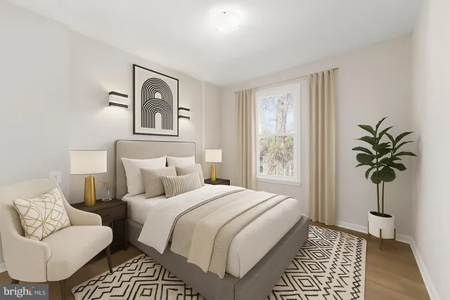 a bedroom with a bed and a couch