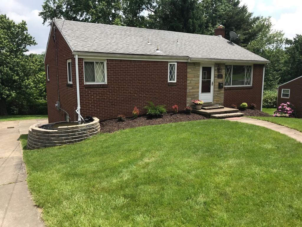 22 Seneca Road Pittsburgh, PA 15241 - Photo 2 of 24 Front Exterior with fish pond and driveway to back.