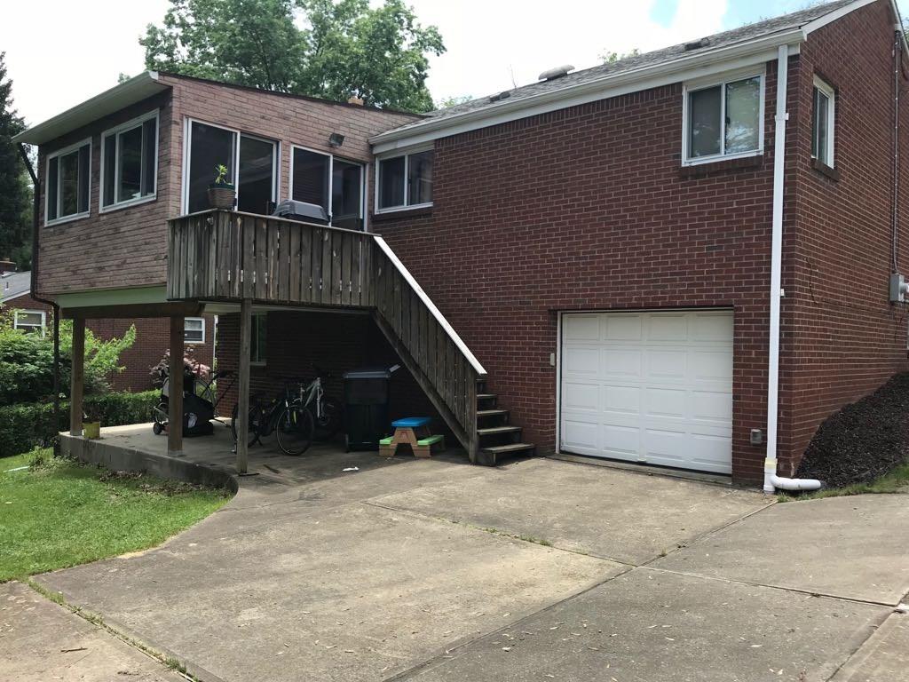 22 Seneca Road Pittsburgh, PA 15241 - Photo 22 of 24 Exterior back to garage, deck and covered patio under deck.