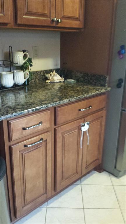 22 Seneca Road Pittsburgh, PA 15241 - Photo 7 of 24 Kitchen cabinets with granite counters and ceramic tile floor.