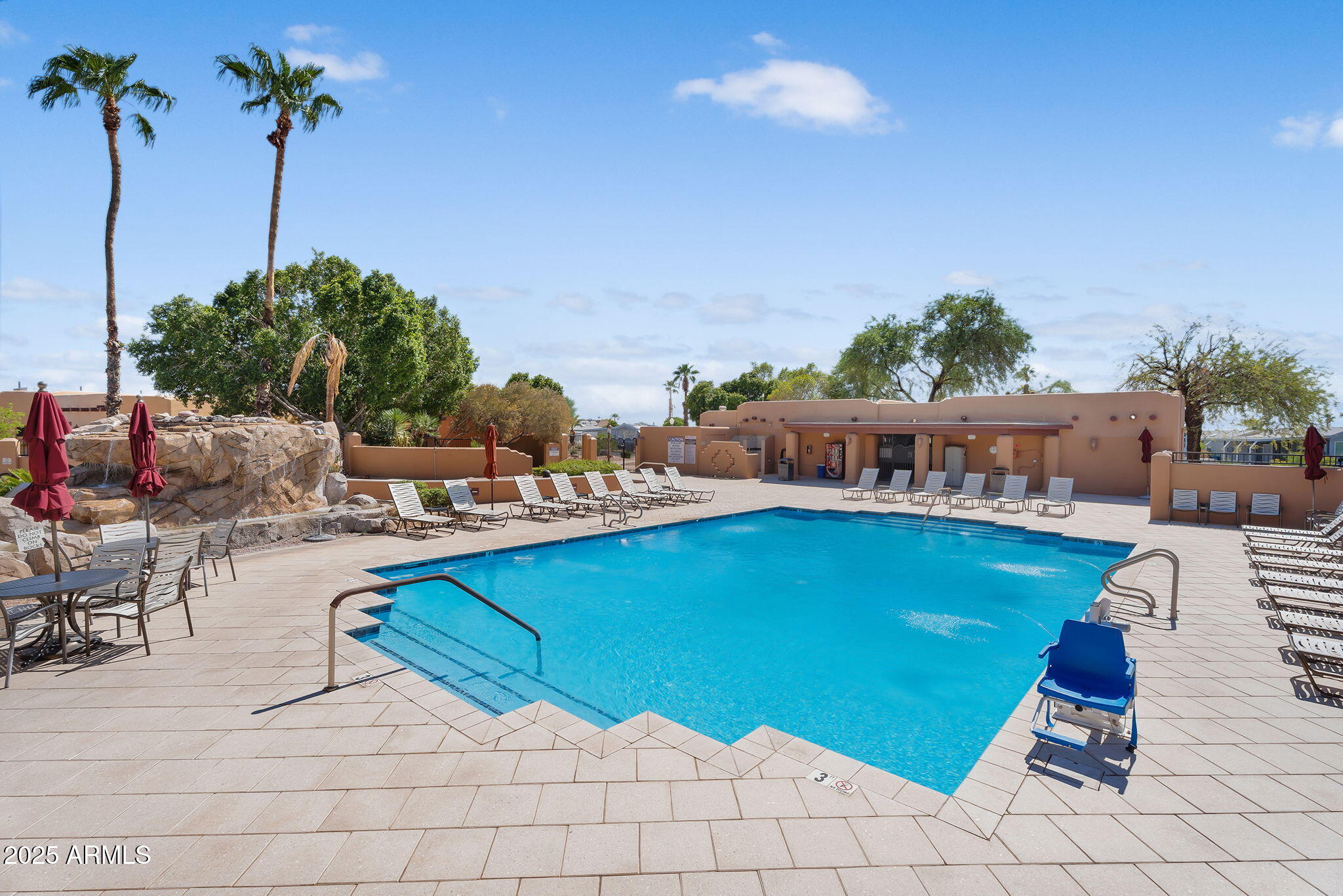 8865 East Baseline Road, Unit 802 Mesa, AZ 85209 - Photo 2 of 44 a view of swimming pool and lounge chair